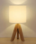 Cozy Kids Table Lamp With Fabric Shade And Wood Tripod Base, emits warm white glow, ideal for kids room or study