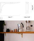 Heavy Duty Shelf Brackets Wall Mount Kickass Brass Metal Supports used to hold a wooden shelf in a kitchen setting, 7" wide.