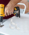 Person using drill with Stainless Steel L Bracket Corner Supports Right Angle Braces For Cabinets Tables Chairs And Wood Furniture DIY Projects