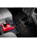 Vehicle 12V Charger For All M18 And M12 Batteries With Smart Sequential Charging Auto Second Pack Starts After First Is Full Built In Protective Electronics shown installed in a car