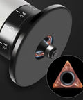 Close-up of Badass 10 Pack Slick Triangle Carbide Cutter Heads For Mini Pneumatic Chamfering Machine with cutter inserted in tool.