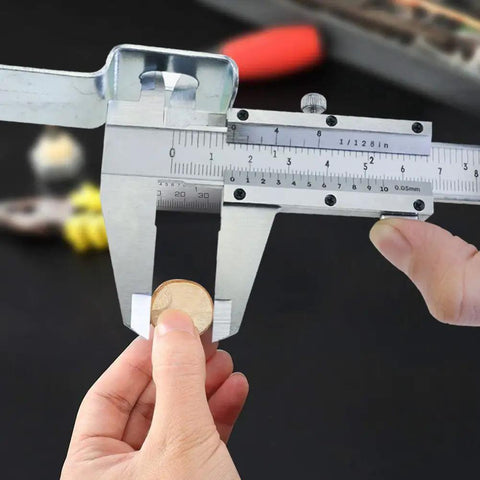 Pro Grade Six Inch Stainless Steel Caliper for Inside Outside Depth and Step Measurements in use measuring coin