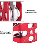 Close-up of a red Single Swivel Rope Pulley Block For Rock Climbing and Hauling, Heavy Duty Aluminum Magnesium Alloy Sheave With Precision Bearing