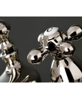 Restoration Style 4-Inch Centerset Bathroom Faucet With Pop-Up Drain, Polished Nickel Finish close-up of cross handles