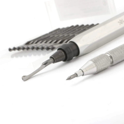 Pro Grade Deburring Tool Kit With 11 High Speed Steel Swivel Blades, tungsten carbide scribe, and CNC aluminum handle on white background