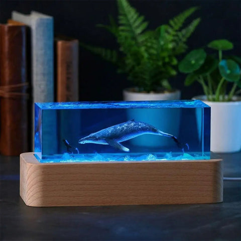 Ocean Scene Resin Night Light With Wood Base Usb Powered Lamp with humpback whale in blue resin and diver on nightstand.