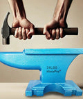 Hands holding hammer above Blue Single Horn Cast Iron Anvil For Blacksmithing And Metal Shaping Beefy Pro Grade Heavy Duty Tool 24 Lbs