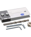 Rock Solid One Quarter Inch Dowel Drilling Jig Kit With Hardened Steel Bore Guides And Clear Acrylic Base, includes drill bits and tools.