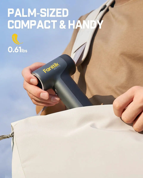 Person holding B10 Pro Electric Air Duster Cordless Desktop Blower With 110000 RPM Brushless Motor MegaBoost grey.