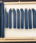 Top Shelf 11 Piece Tungsten Carbide Lathe Turning Tool Set With Heavy Duty Boring Bars And Roughing Grooving Inserts Built Tough, arranged in a wooden case.