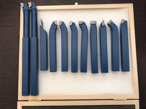 Top Shelf 11 Piece Tungsten Carbide Lathe Turning Tool Set With Heavy Duty Boring Bars And Roughing Grooving Inserts Built Tough, arranged in a wooden case.