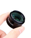 0.5x Focal Reducer For 1.25 Inch Eyepieces With Full Multi Coating held between fingers, showing lens and metal body