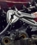 Cobra ES Extra-Slim 10 Inch Pump Pliers With Narrow Jaws gripping wire in automotive maintenance.