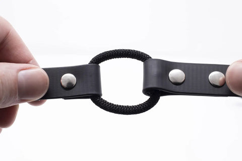 Close-up of 3-4 Inch Biothane Bungee Dog Training Collar Strap For Educator Receivers with metal fixtures, black, for small and medium dogs.