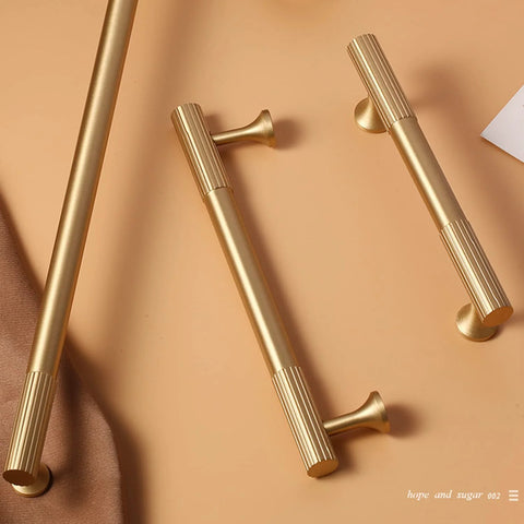 Brushed Gold Modern Kitchen Cabinet Handles Set 5 Pack Solid Brass Drawer Pulls shown lying flat on a surface