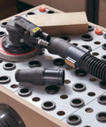 Orbital sander connected to 10 Foot Vacuum Hose Kit With 1 Inch And 1 1/2 Inch Quick Change Adapters Plus Two And A Quarter Inch To Two And A Half Inch Dust Port Adapter For Dust Collection Systems Connecting Table Saws And Power Tools To Shop Vacuums on a workbench