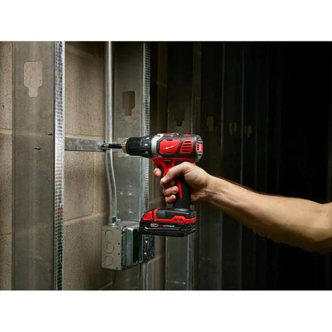 Heavy Duty 18V Cordless Compact Drill Driver Kit Delivers Badass Torque To Your Worksite Comes Loaded With Dual Rapid Fire Batteries And Tough Contractor Carry Bag For Daily Grind in use, drilling into metal framing.
