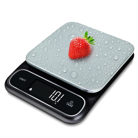Beast Mode Precise Waterproof Digital Kitchen Scale With 0.1g Accuracy, 11lb Capacity, measuring strawberry on platform
