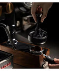 Straight Up 58mm Espresso Distributor Tool For Solid Portafilter Bed Leveling With Heavy Duty Stainless Steel Build is shown in use for precise coffee leveling.