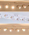Six Light Flexible Track Lighting With 45.67 Inch Arms And 350 Degree Rotating Heads In Natural Wood Shade Dope And Sleek Ceiling Track Fixture For Living Room Dining Room Kitchen And Studio White displaying all lights with different angles and natural wood accents in modern setting.