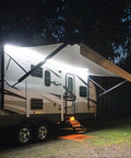 RV Awning Lights 16Ft 12V White LED Canopy Lighting on exterior of motorhome, illuminating camping area and surroundings at night.