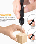 Using a 62 Piece Pin Vise Hand Drill Bits Set Micro Twist Kit for precise drilling into a small wooden block.