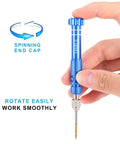 Hand holding Ultra Handy Mini Precision Screwdriver with blue non-slip handle and magnetic bit, showing spinning end cap feature