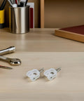 Smooth Operation Curtain Track Pulley Set Featuring Rock Solid Plastic Double Wheel Rollers For Seamless Sliding On Straight Or Curved Tracks Zero Hassle Easy DIY Fix - white plastic gliders on wooden desk.