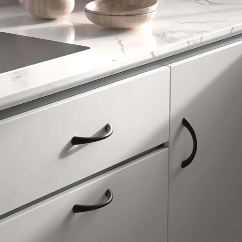 Dope Fit for Your Home with These 5-Inch Curved Cabinet Handles Black Drawer Pulls for Dressers and Kitchens Solid Zinc Alloy 10 Pack Includes Screws Smooth Design for a Fresh Modern Look on white cabinets.