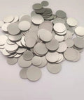 Pile of 316 Stainless Steel Spacer For CR2032 Coin Cell Battery 15.8 X 1 mm Flat Gasket 1000 Pack, shown on white background