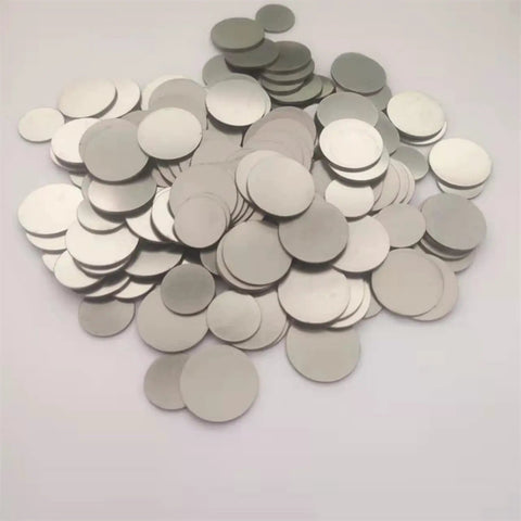 Pile of 316 Stainless Steel Spacer For CR2032 Coin Cell Battery 15.8 X 1 mm Flat Gasket 1000 Pack, shown on white background
