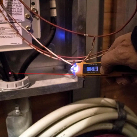 Hand using Non Contact Voltage Tester With IR Thermometer For HVAC Detects 12 To 1000 V AC With LED And Audible Alarms on wires