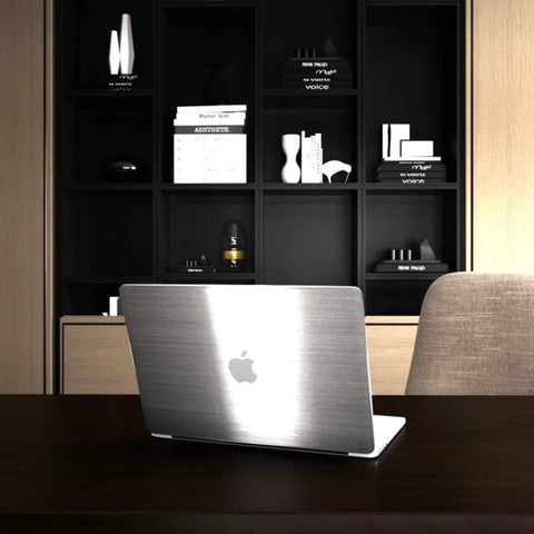 Stainless Steel Look Peel And Stick Countertop Wrap on laptop in modern office setting.