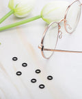 Glasses with black silicone rings from 60 Pcs Eyeglass Hinge Tighteners And Repair Kit With 2 Screwdrivers Silicone Frame Grips For Loose Temple Arms Quick On The Go Eyewear Fix Durable Silicone Rings Easy Adjustments For Glasses