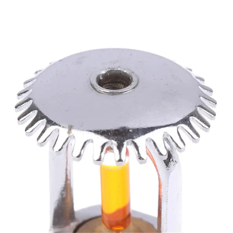Close-up of Pro Grade 57 Degree Pendent Concealed Fire Sprinkler Head showing chrome finish and orange thermal element.