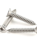 Top Shelf 304 Stainless Steel Number 12 X 1-1/2 Flat Head Sheet Metal And Wood Screws, close-up showing three screws.