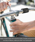 Person adjusting bike handlebar with Bike Handlebar Shim Set 1 Pair 25.4 To 31.8 Mm Aluminum Alloy Clamp Spacer Conversion Adapter.