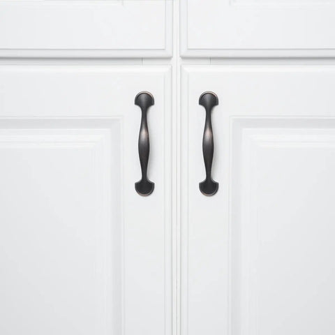 Oil Rubbed Bronze Rounded Foot Cabinet Pulls 4.63 Inches Long With 3 Inch Center, 1 Inch Projection, shown on white cabinets