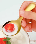 Hand holding spoon from 2 Piece Portable Fork And Spoon Set For Camping Picnics And Outdoor Dining with soup and tomato slice