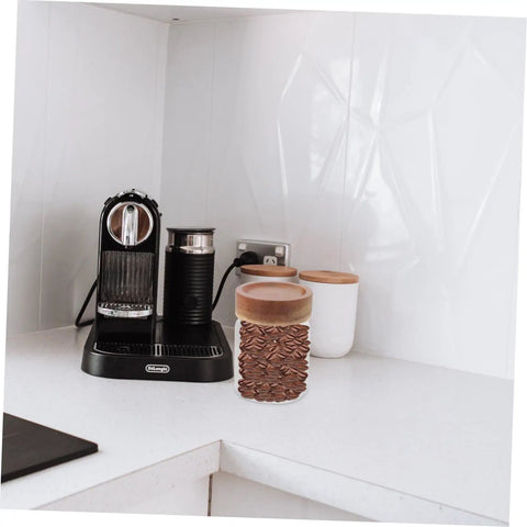 Keep Coffee Beans Fresh As Heck With This Solid 3 Piece Airtight Glass Canister Set Designed For Loose Tea And Spices Compact Footprint Saves Counter Space And Locks In Flavor Straight Up on kitchen counter next to espresso machine.