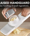 KEOUKE multifunctional mandoline slicer with stainless steel surface and 6 blades; handheld cutter with hand guard