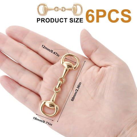 Hand holding Six Piece Set Medium Horse Bit Buckles D Ring Gold Snaffle Buckles Perfect For Women Must Have Create Exquisite Jewelry