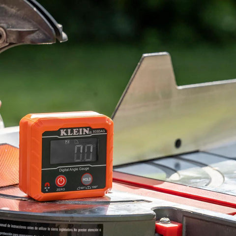 Klein Tools 935DAG digital angle gauge, orange plastic, front view with LCD display