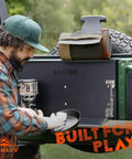 Man using Spill Ender 3 In 1 Paper Towel Holder for cars and campsites mounted on vehicle, rugged design displayed.
