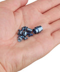 Titanium Hardware Kit For Paramilitary PM2 Knife With 9 Screws Plus Main Pivot Lanyard Tube Standoff Spacer And Blade Stop Pin In Blue held in hand.