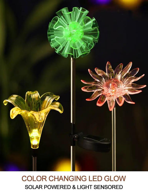 Solar Stake Lights With Color Changing LEDs And Life Size Figurines, Assorted Multicolor Outdoor Garden Decor, 3 Count For Day And Night Yard Vibe That Pops In Any Season featuring green, pink, and yellow LED flowers.