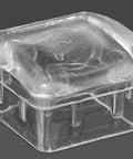 Close-up of a clear non-marking leg glide for one and a quarter inch square angled furniture legs, floor protector design.