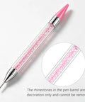 Wax Pencil For Rhinestones And Nail Art with dual head, pink rhinestones in barrel, close-up of decorative detail