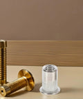 70 Piece M5 Stainless Steel Flat Head Rivet Nuts Kit with Threaded Inserts for Furniture Repairs shown with brass bolts