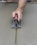 Using Stainless Groover from Concrete Starter Tool Kit In Tough Canvas Bag With Six Essential Tools Including Finishing Trowel, Magnesium Hand Float, Stainless Groover, Curved Edger, Wood Float, Margin Trowel, Made In USA CTK2 on wet concrete surface.